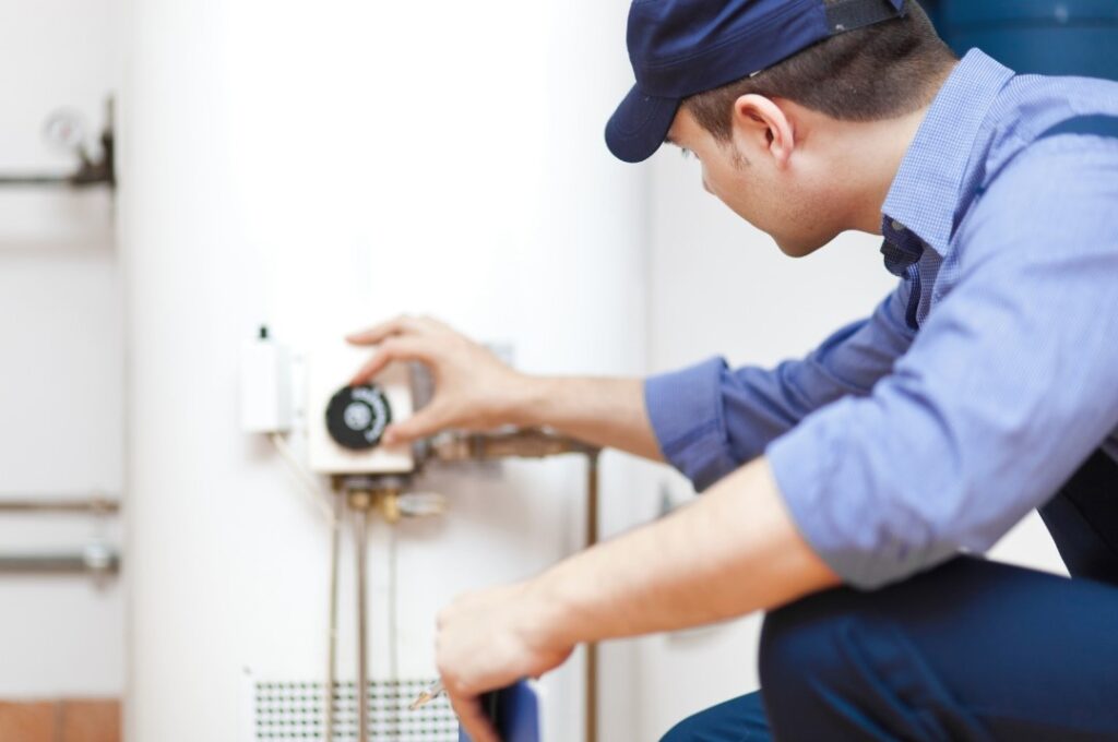 plumber fixing water heater